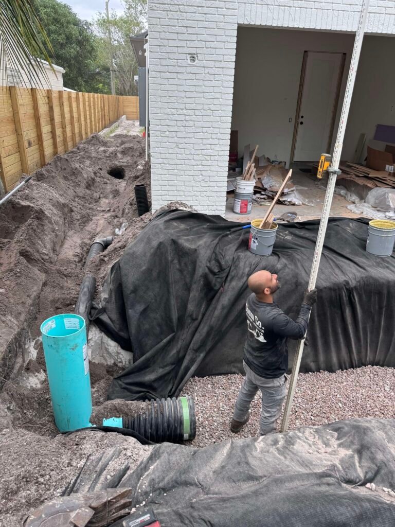 Exfiltration system stone pipe installation Palm Beach