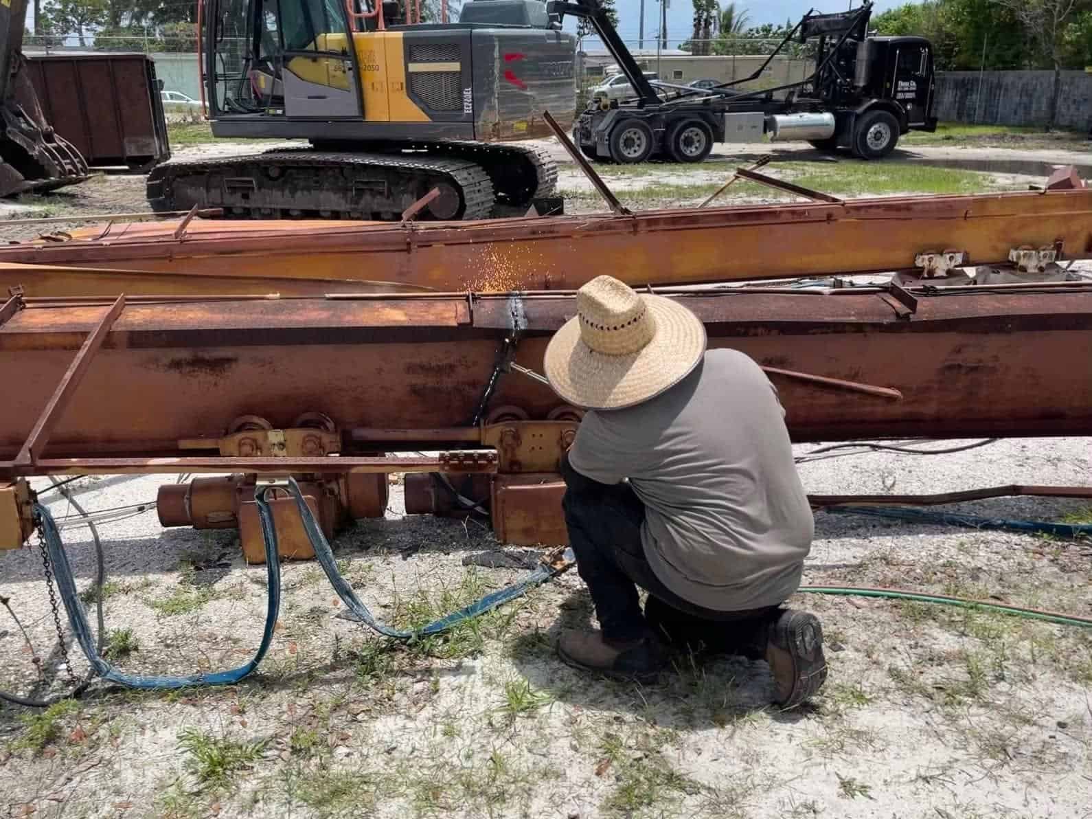 Steel structure demolition, torching beams.