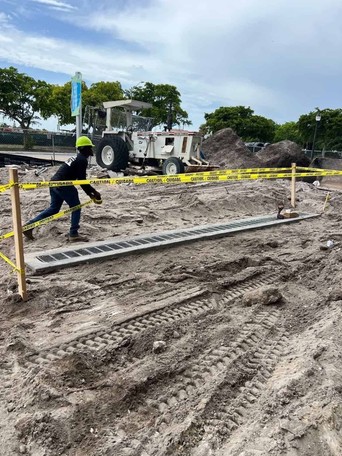 Completed commercial trench drain taped off to cure and stay protected in West Palm Beach, FL