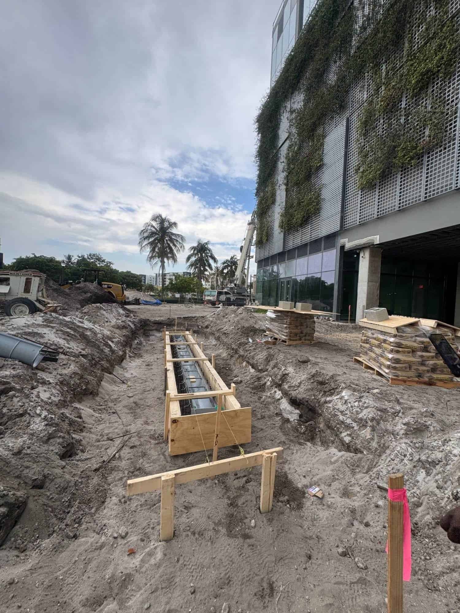 Trench drain formwork on a commercial tower construction site in West Palm Beach, FL