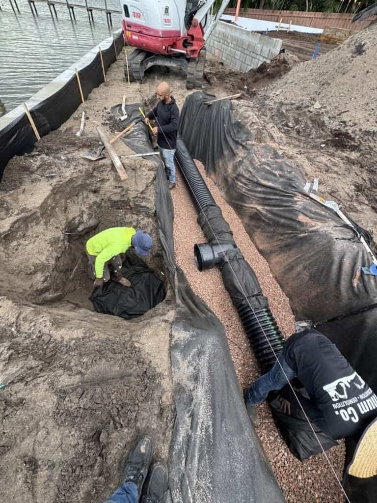 Exfiltration trench with filter fabric and gravel bedding Tequesta Florida