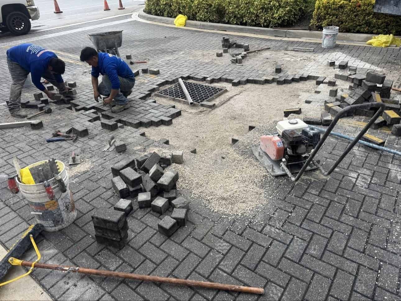 Reinstalling pavers around storm drain basin Boynton Beach Florida
